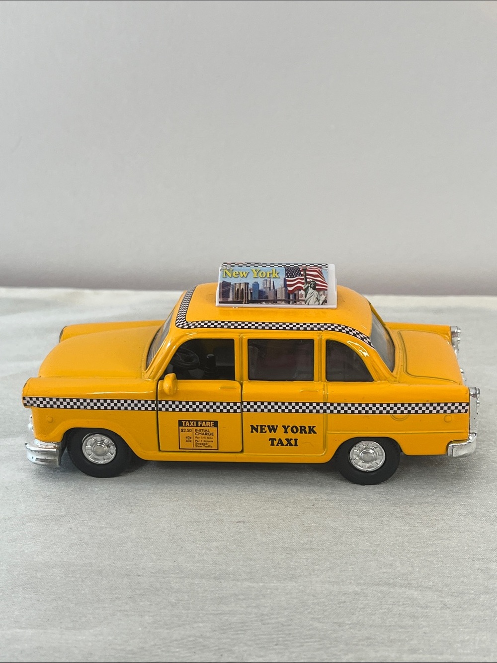 Classic New York City Yellow Cab Toy Car by Shing Fat Ltd.